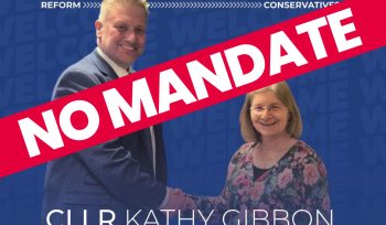 Councillor Broadbent shaking hands with councillor Gibbon