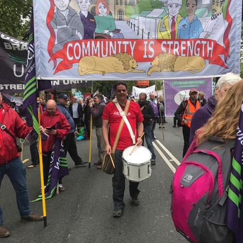 Community is Strength banner on March